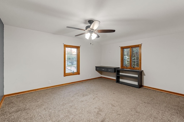1218 4th Ave SE, Austin, MN 55912 - carpeted empty room featuring baseboards and a ceiling fan