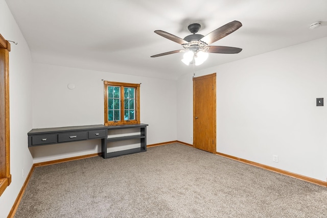 1218 4th Ave SE, Austin, MN 55912 - carpeted spare room with a smoke detector, a ceiling fan, and built in desk