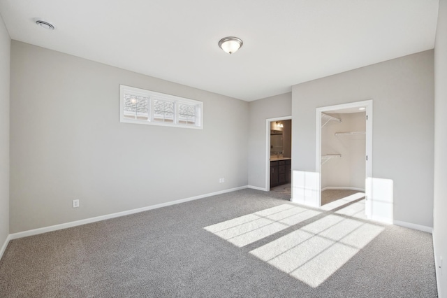 8007 Walnut Ln, Corcoran, MN 55340 - unfurnished bedroom with carpet flooring, a spacious closet, and a closet