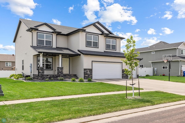 5480 Tanner Ave S, Fargo, ND 58104 - craftsman inspired home with concrete driveway, a garage, stone siding, board and batten siding, and covered porch
