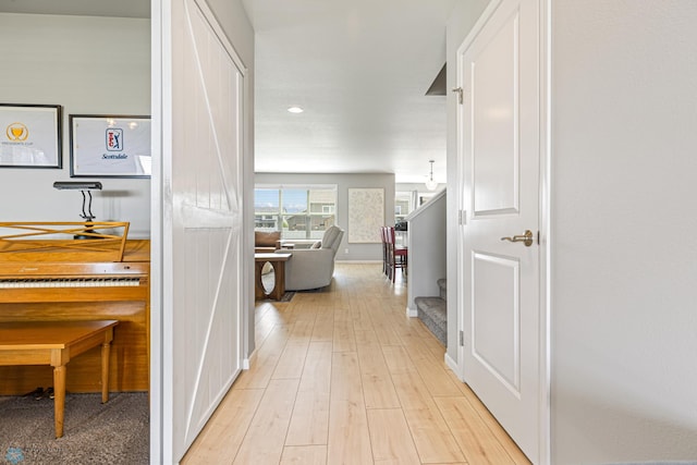 5480 Tanner Ave S, Fargo, ND 58104 - hallway with light wood finished floors, recessed lighting, and stairway