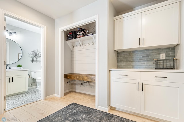 5480 Tanner Ave S, Fargo, ND 58104 - mudroom featuring light wood finished floors and baseboards