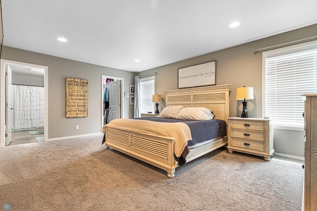 5480 Tanner Ave S, Fargo, ND 58104 - bedroom featuring carpet flooring, a walk in closet, recessed lighting, ensuite bath, and a closet