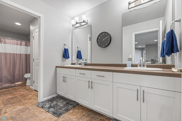 5480 Tanner Ave S, Fargo, ND 58104 - bathroom with double vanity, stone finish flooring, and a shower with shower curtain