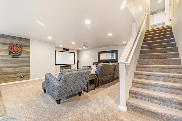5480 Tanner Ave S, Fargo, ND 58104 - home theater featuring light colored carpet, recessed lighting, and wooden walls