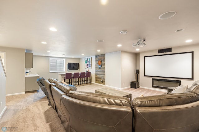 5480 Tanner Ave S, Fargo, ND 58104 - home theater room featuring recessed lighting, light colored carpet, and bar area