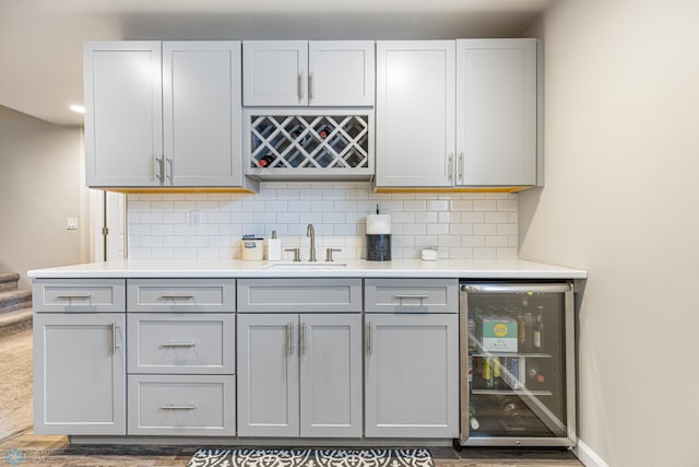 5480 Tanner Ave S, Fargo, ND 58104 - indoor bar featuring wine cooler and decorative backsplash