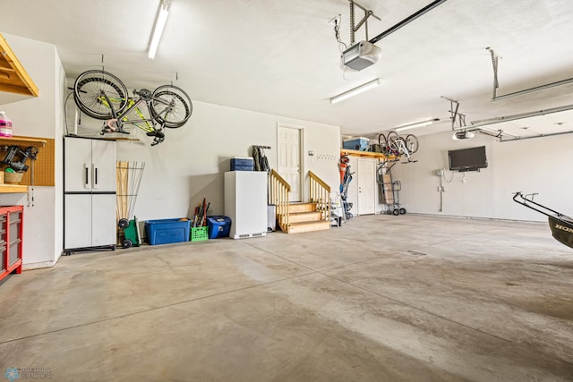 5480 Tanner Ave S, Fargo, ND 58104 - garage featuring a garage door opener
