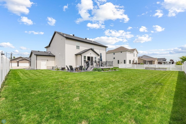 5480 Tanner Ave S, Fargo, ND 58104 - back of property featuring a fenced backyard, a wooden deck, and a patio area