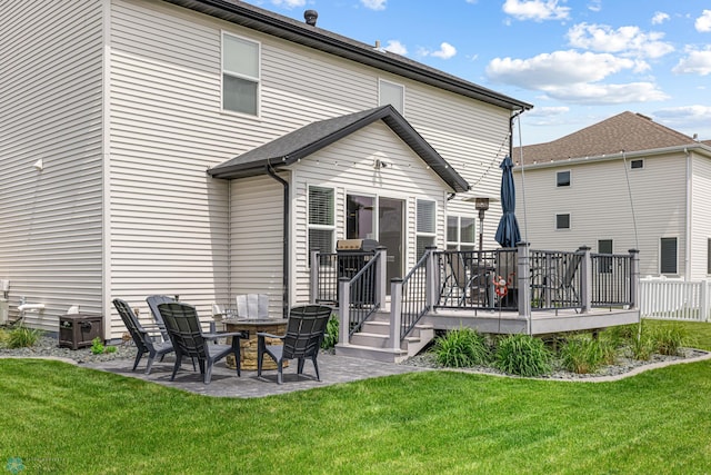 5480 Tanner Ave S, Fargo, ND 58104 - rear view of property with a wooden deck, a lawn, and a patio