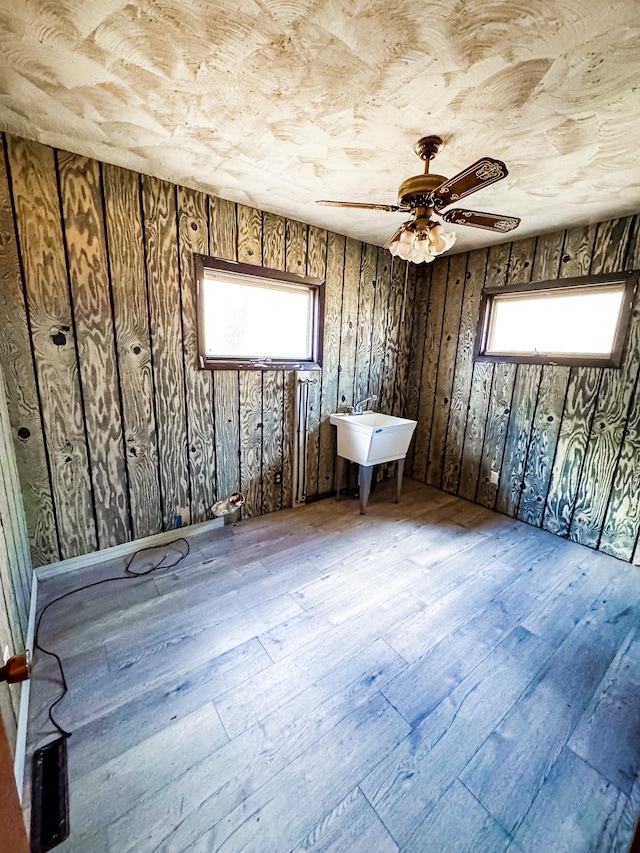 2284 15th St, Johnstown Twp, WI 54826 - spare room featuring hardwood / wood-style floors, plenty of natural light, and a ceiling fan