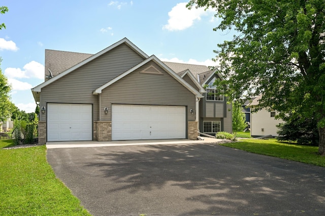 1212 Francis Dr, Elko New Market, MN 55054 - view of front facade with asphalt driveway, a garage, a front lawn, and roof with shingles