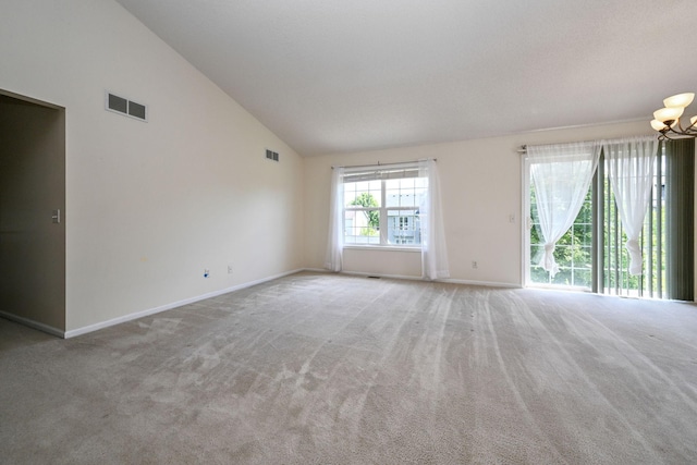 1212 Francis Dr, Elko New Market, MN 55054 - carpeted empty room with a chandelier and high vaulted ceiling