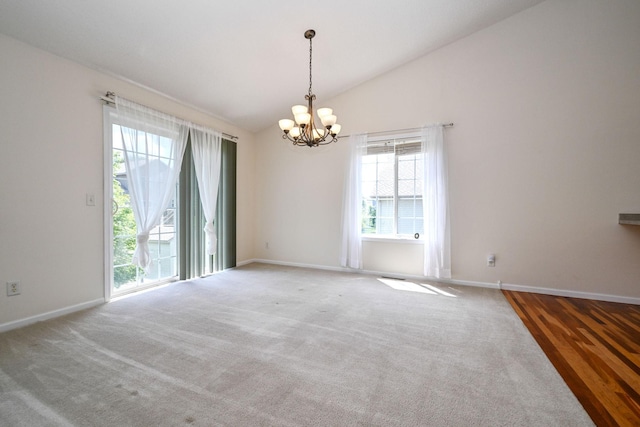 1212 Francis Dr, Elko New Market, MN 55054 - empty room featuring a chandelier, lofted ceiling, and carpet floors