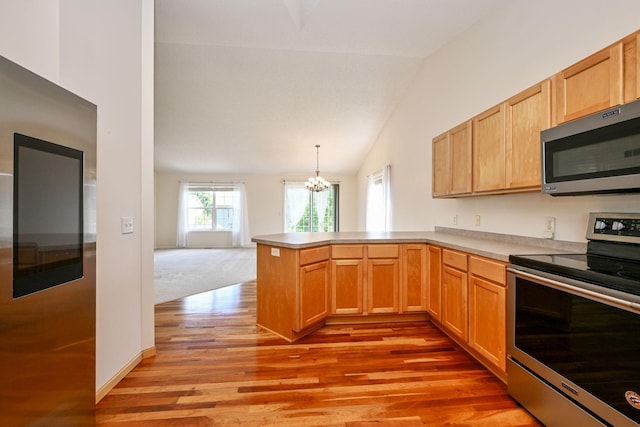 1212 Francis Dr, Elko New Market, MN 55054 - kitchen featuring appliances with stainless steel finishes, vaulted ceiling, a peninsula, light wood finished floors, and a chandelier