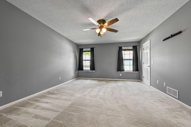 1212 Francis Dr, Elko New Market, MN 55054 - empty room featuring a textured ceiling, ceiling fan, and carpet flooring