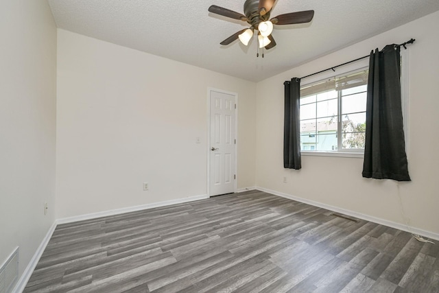 1212 Francis Dr, Elko New Market, MN 55054 - spare room featuring wood finished floors, ceiling fan, and a textured ceiling