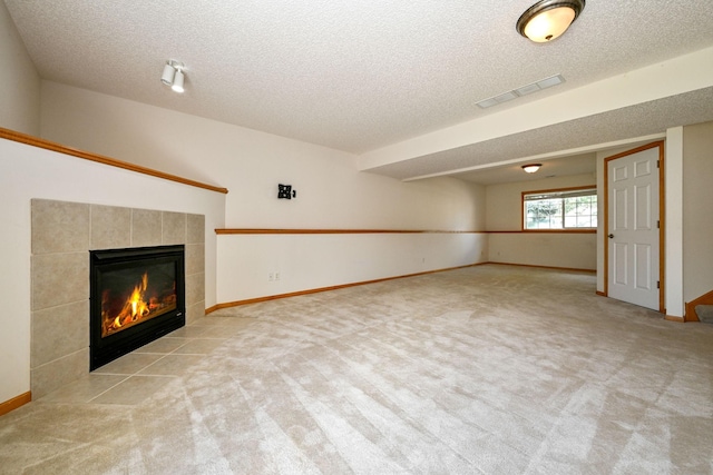1212 Francis Dr, Elko New Market, MN 55054 - unfurnished living room featuring a fireplace, carpet, and a textured ceiling