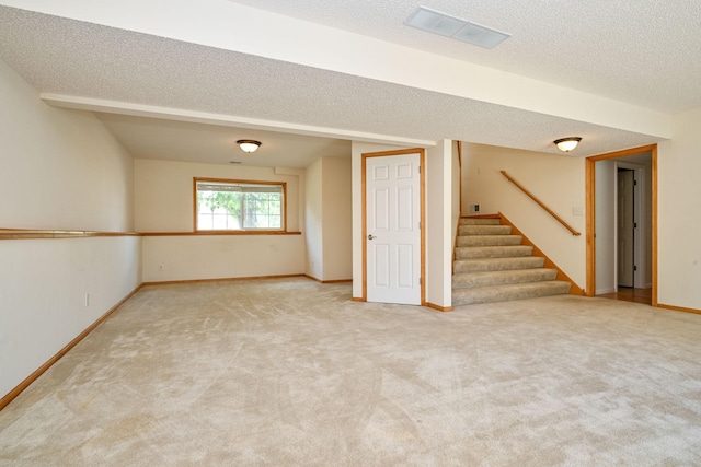 1212 Francis Dr, Elko New Market, MN 55054 - spare room with a textured ceiling, carpet floors, and stairs