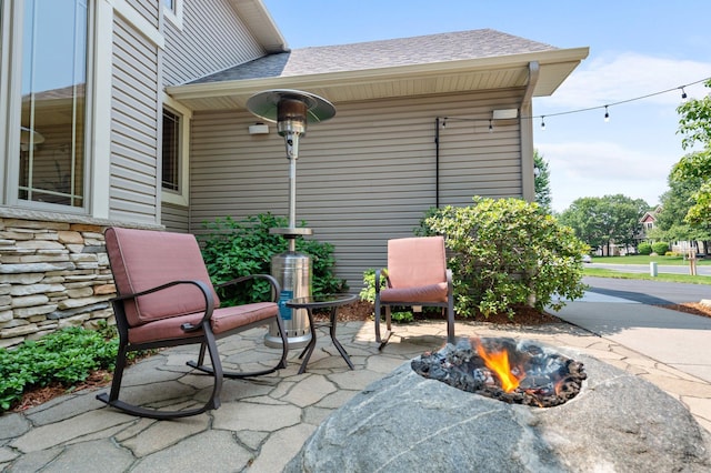 2334 Veterans Memorial Blvd NW, Andover, MN 55304 - view of patio featuring a fire pit