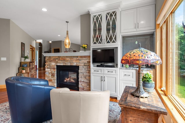 2334 Veterans Memorial Blvd NW, Andover, MN 55304 - living room featuring wood finished floors, a stone fireplace, and recessed lighting