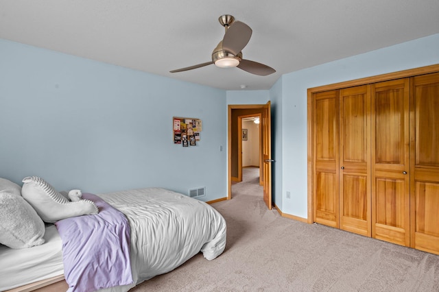 2334 Veterans Memorial Blvd NW, Andover, MN 55304 - bedroom with light carpet, a ceiling fan, and a closet