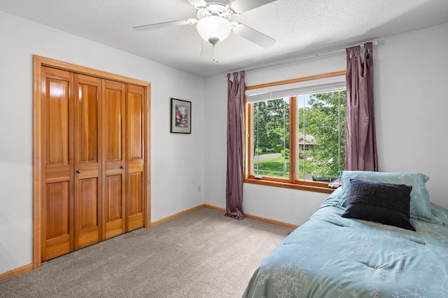 2334 Veterans Memorial Blvd NW, Andover, MN 55304 - bedroom with light colored carpet, ceiling fan, and a textured ceiling