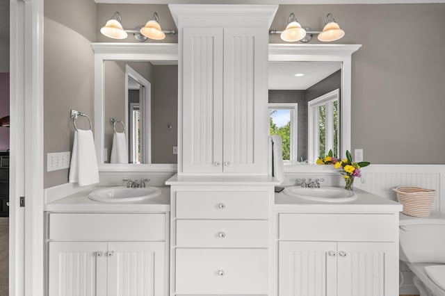 2334 Veterans Memorial Blvd NW, Andover, MN 55304 - full bath featuring vanity and wainscoting