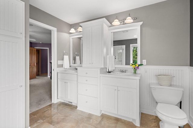 2334 Veterans Memorial Blvd NW, Andover, MN 55304 - bathroom with double vanity and wainscoting