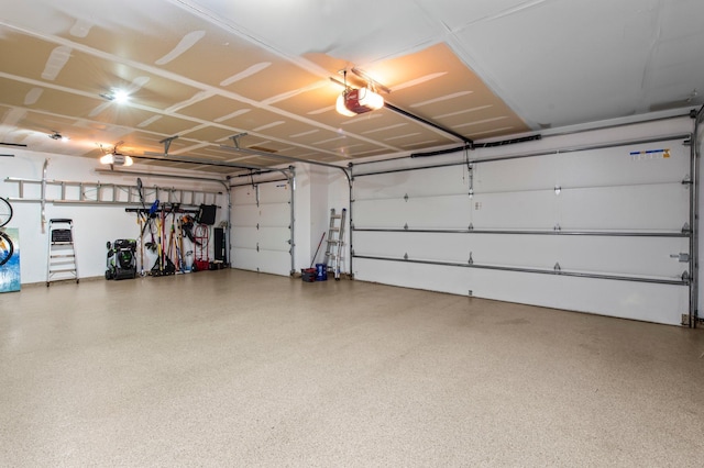 2334 Veterans Memorial Blvd NW, Andover, MN 55304 - garage featuring a garage door opener