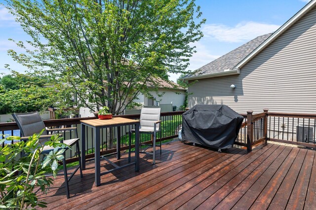 2334 Veterans Memorial Blvd NW, Andover, MN 55304 - deck featuring a grill and outdoor dining space