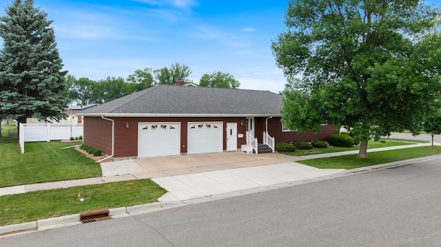 109 Pine Ave N, Canby, MN 56220 - ranch-style house with an attached garage, roof with shingles, concrete driveway, and entry steps