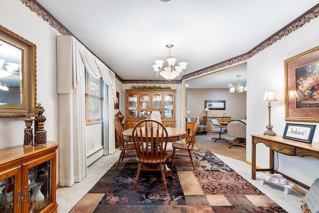 109 Pine Ave N, Canby, MN 56220 - dining area with a chandelier, a baseboard heating unit, and light carpet