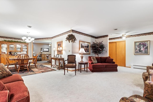 109 Pine Ave N, Canby, MN 56220 - living area with carpet flooring, a chandelier, a baseboard radiator, and ceiling fan