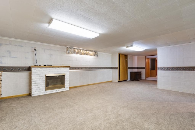 109 Pine Ave N, Canby, MN 56220 - finished basement with carpet floors, a fireplace, and wallpapered walls