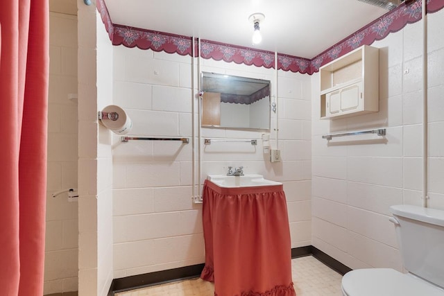 109 Pine Ave N, Canby, MN 56220 - bathroom with tile patterned floors and tile walls