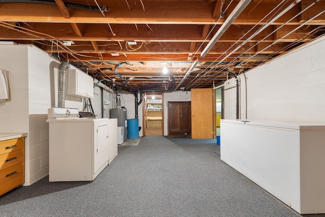 109 Pine Ave N, Canby, MN 56220 - basement with washer and dryer, electric water heater, fridge, and carpet flooring