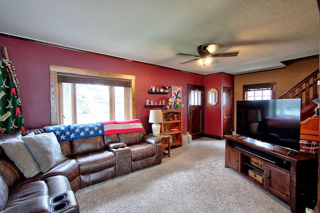 1936 5th St, Red Wing, MN 55066 - living area featuring ceiling fan, light colored carpet, a textured ceiling, and stairway