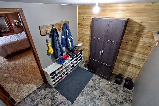 1936 5th St, Red Wing, MN 55066 - mudroom with wooden walls and stone finish floors