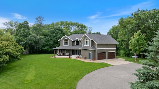 18505 210th Ave NE, Paynesville, MN 56362 - view of front of property featuring covered porch, an attached garage, a front yard, and concrete driveway