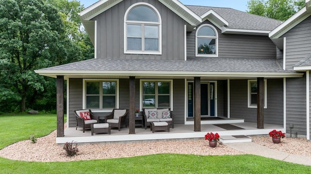 18505 210th Ave NE, Paynesville, MN 56362 - view of front of home featuring a porch, a front lawn, board and batten siding, and a shingled roof