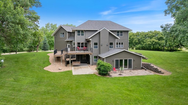 18505 210th Ave NE, Paynesville, MN 56362 - rear view of house with a patio area, a deck, and a yard