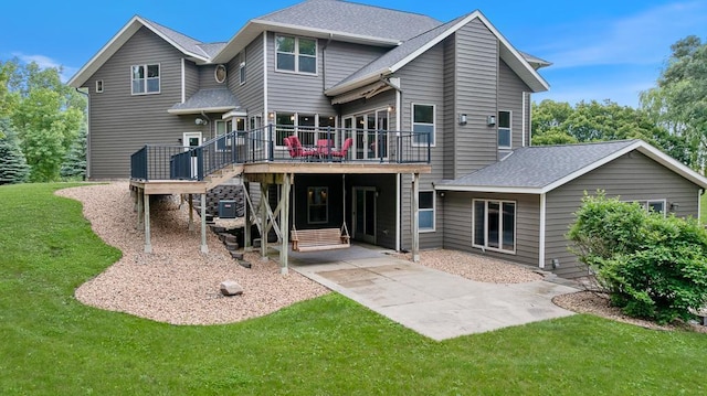 18505 210th Ave NE, Paynesville, MN 56362 - rear view of house featuring a deck, stairs, a yard, a patio, and a shingled roof