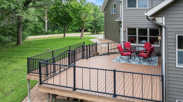 18505 210th Ave NE, Paynesville, MN 56362 - wooden terrace with a lawn and outdoor dining area