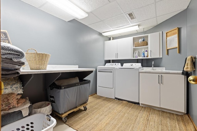 18505 210th Ave NE, Paynesville, MN 56362 - laundry area with cabinet space and washing machine and clothes dryer