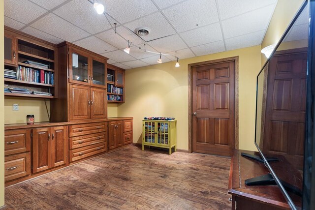 18505 210th Ave NE, Paynesville, MN 56362 - home office with rail lighting, dark wood-type flooring, and a paneled ceiling