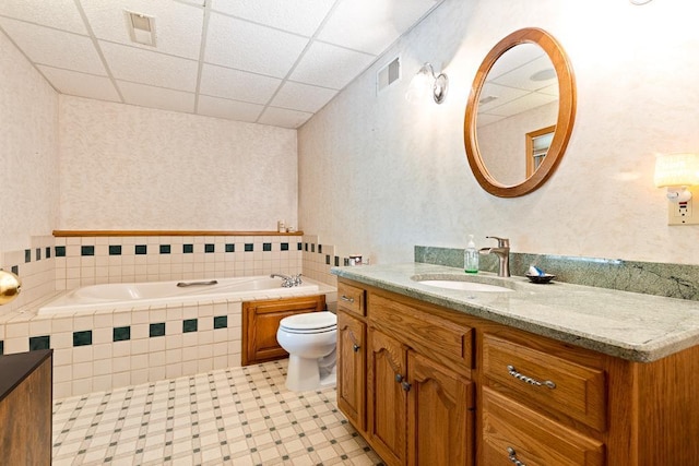 18505 210th Ave NE, Paynesville, MN 56362 - bathroom with a bath, vanity, a drop ceiling, and tile patterned floors