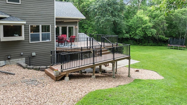 18505 210th Ave NE, Paynesville, MN 56362 - view of green lawn featuring a trampoline and a deck