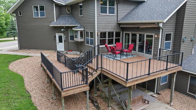 18505 210th Ave NE, Paynesville, MN 56362 - rear view of property featuring roof with shingles and a wooden deck