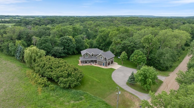 18505 210th Ave NE, Paynesville, MN 56362 - aerial view of property and surrounding area featuring a heavily wooded area